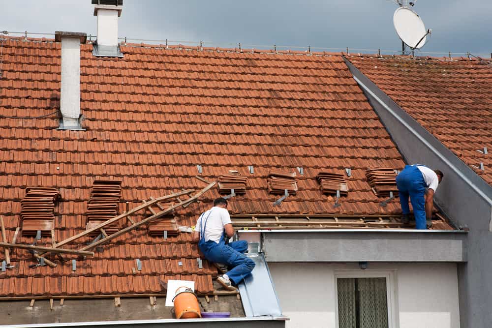 Two,Men,Working,On,The,Roof