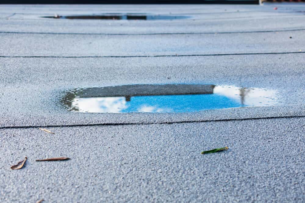 flat roof with water pooling on top of it